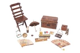 An early 20th century papier mache box, modelled as a wooden toy trunk, 19 cm x 34 cm x 19 cm, conta