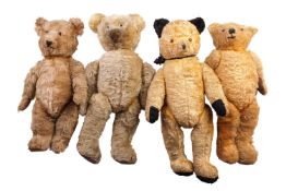 Four assorted large mohair teddy bears, each with jointed limbs, early 20th century and later, one w