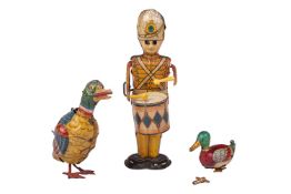 A United State MAR Toys tin plate clockwork soldier, with drum, 23 cm, together with two tinplate cl