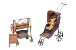 A child`s Triang washstand set, comprising a green and red-painted mangle, on four rubber mounted wh