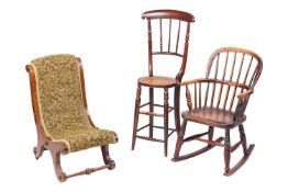 An early 20th century child's (or doll's) Windsor rocking armchair, 79 cm high x 43 cm wide, togethe