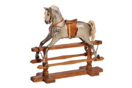 An Ayres type dappled grey painted rocking horse, with pine base and runners, with real horsehair an