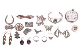 A group of white metal jewellery items; to include a smoky quartz silver brooch, a silver horseshoe 