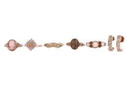 A group of five rings and a pair of earrings; The first a 9ct yellow gold citrine and cubic zirconia