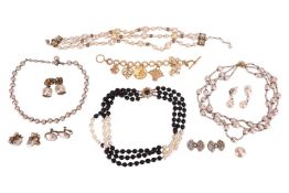 A large group of costume jewellery by Miriam Haskell, comprising a charm bracelet, a triple-row neck