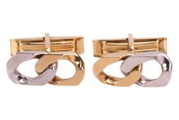 A pair of two-toned curb link cufflinks, each consisting of bi-coloured flat curb links, with toggle