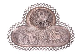 A silver inkstand, by Harris Brothers, London 1896, the tray of trefoil form, featuring repoussé wor