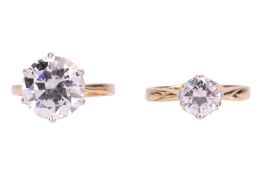 Two CZ-set rings, the first featuring a CZ measuring approximately 12mm, in a 14ct yellow gold mount
