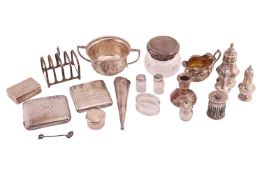 An agglomeration of small items of silver, including a conical 