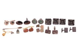 A collection of cufflinks, buttons, tie tacs and a stick pin, including a pair of rounded rectangula