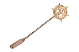A stick pin of nautical interest, with a helm motif engraved 'Mariner's Wharf', celebrating the Sout
