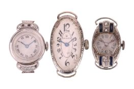 Three Dress Watches; The first a colourless sapphire-set watch, in a round white metal case stamped 