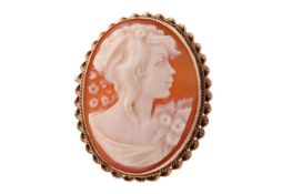 A 9ct Cameo Brooch, featuring the bust of a woman in profile, to a yellow gold mount with twisted wi