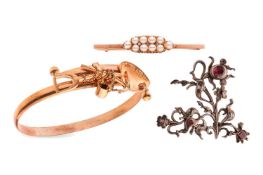 A group lot of three jewellery items; featuring a bar brooch set with a cluster of ten half pearls i