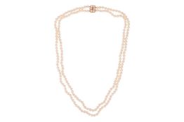 A double row cultured pearl necklace with 9ct gold clasp, comprising two rows of round cultured pear