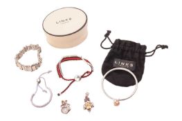 A group of four Links of London bracelets, to include two silver and cord friendship bracelets, a cl