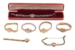 A group of seven watches; To include six gold-plated dress watches of varying brands and sizes; A Ro