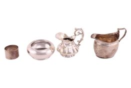 A George III silver milk jug, with stippled foliate band decorations and an angular handle, London 1