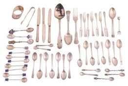 A group of mixed flatware comprising a pair of silver sugar nips, fifteen assorted silver tea spoons
