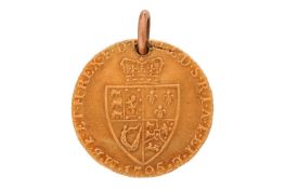 A George III Guinea, dated 1795, pierced with a pendant ring, gross weight 8.6g.