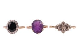 A single stone oval amethyst dress ring, together with a sapphire and diamond oval cluster ring and 