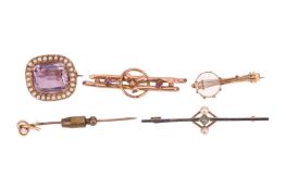 A collection of five Victorian and Edwardian gem-set brooches; including an amethyst with seed pearl