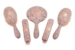 A silver-mounted five-piece dressing table set, Birmingham 1990. In a fitted case.