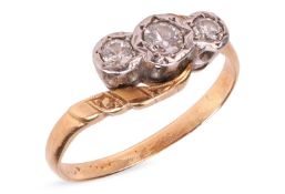 A diamond-set three-stone ring, of crossover design and illusion-set with three round brilliant-cut 