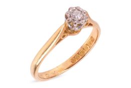 A diamond-set solitaire ring, illusion-set with a round brilliant-cut diamond measuring approximatel