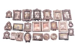 Twenty three silver-mounted photo frames with easel back.