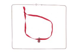 A garnet-set pendant with chain, claw-set with a circular-cut garnet of 6.0mm, in white metal mount 