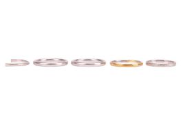 A small group of jewellery; comprising four band rings, one hallmarked platinum, the other three exa