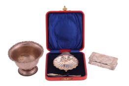 A silver sugar bowl with a floral border, on a circular stepped foot; a cased shell butter dish on b