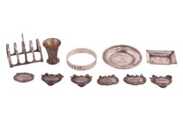 A set of five wine labels, stamped 'sterling', together with one further wine label, a silver toast 