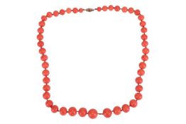 A coral bead necklace, comprising a series of graduated corallium rubrum button beads, sized from 7.