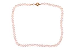 A cultured pearl necklace, comprising a single row of white egg-shaped cultured pearls, with a ball 