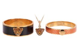 A collection of two enamel bangles and a pendant necklace by Halcyon Days, the Salamander bangle wit