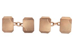 A pair of 9ct gold cufflinks, the head of each cufflink of octagonal form with radiating engraving, 