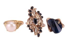 Three gem-set dress rings, comprising a cultured pearl-set ring in a yellow metal mount surface test