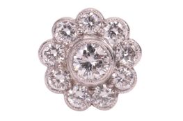 A single diamond-set cluster earring, or floral form, the stud featuring seven round brilliant-cut d