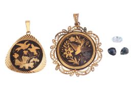 A small group of jewellery items; To include two gold-plated Damascene pendants, each featuring foli