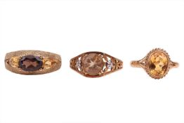 Three dress rings, comprising a smoky quartz and citrine-set ring, in a textured 9ct gold mount, siz