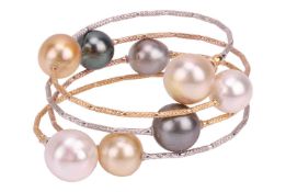 A cultured pearl and wire bracelet, of wraparound design, composed of cultured pearls, of varying co