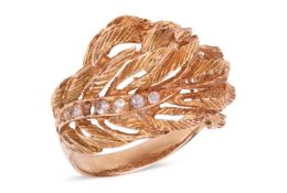 A white sapphire dress ring, of foliate and openwork design, highlighted by two rows of circular-cut