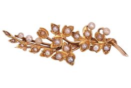 An Edwardian spray brooch set with seed pearls, brooch fittings to the reverse, unmarked yellow meta