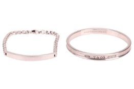 Tiffany & Co. - a silver ID bracelet with vacant curved bar connecting to a series of box links,