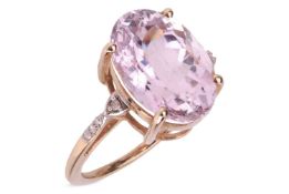 A kunzite solitaire ring in 9ct yellow gold, claw-set with an oval-cut kunzite of 14.0 x 9.8 x 7.5 m