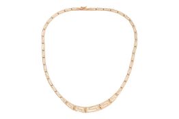 A collar necklace of Greek Key design, with hinged and graduated links completed with a box clasp, y