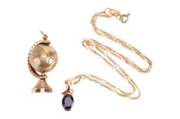 A sapphire and diamond pendant in yellow metal mount testing as 18ct, on a 9ct gold Figaro link chai