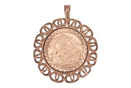 A 1979 half Sovereign coin pendant, depicting St George slaying the dragon, within a 9ct gold pierce